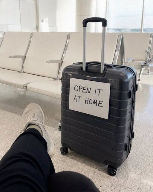 I found myself waking up at the airport with an unfamiliar suitcase next to me. Attached to it was a note that read, “Open it at home.”